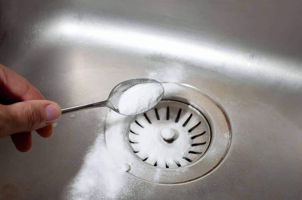putting baking soda on a drain