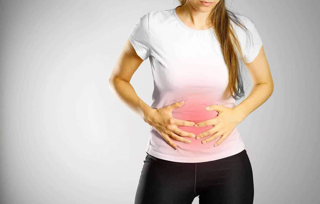 woman experiencing abdominal pain after eating candle wax 
