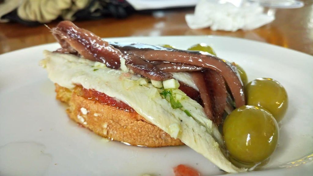 canned anchovies on a plate
