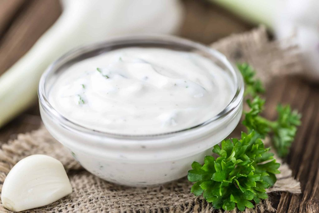 garlic sauce with herbs in a bowl