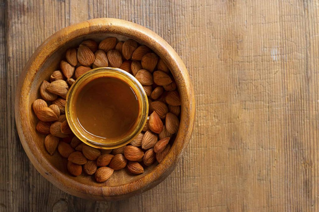 apricot urbech and apricot seeds in a bowl