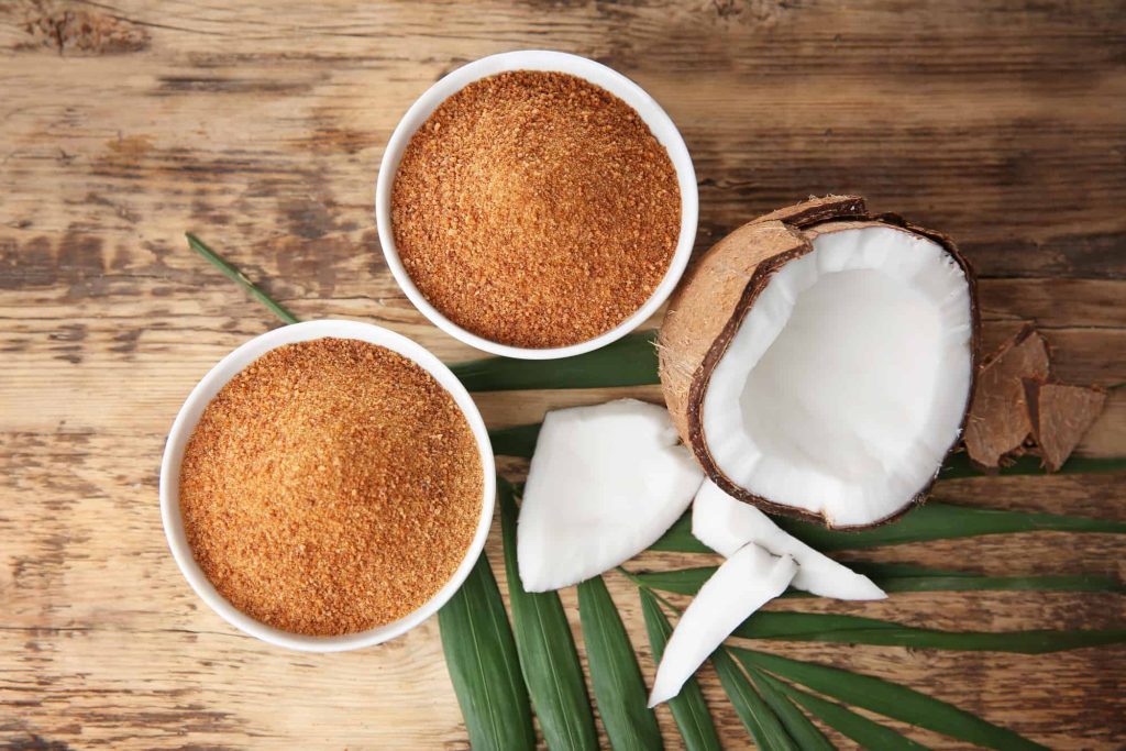 two bowls of coconut sugar and fresh coconut