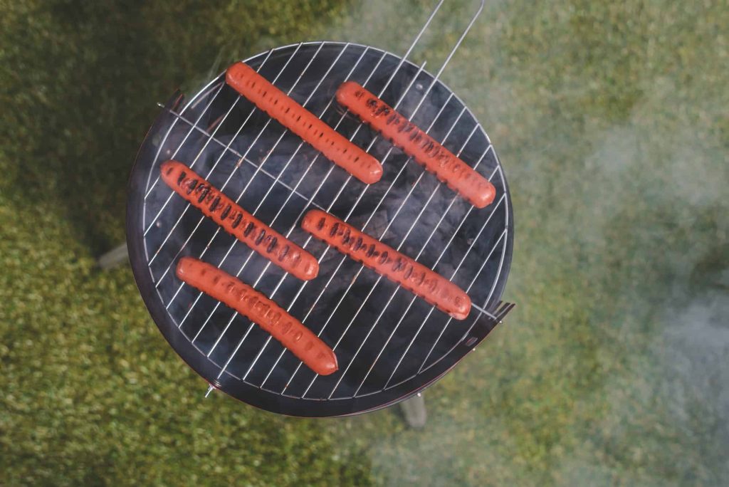 hot dogs on a grill