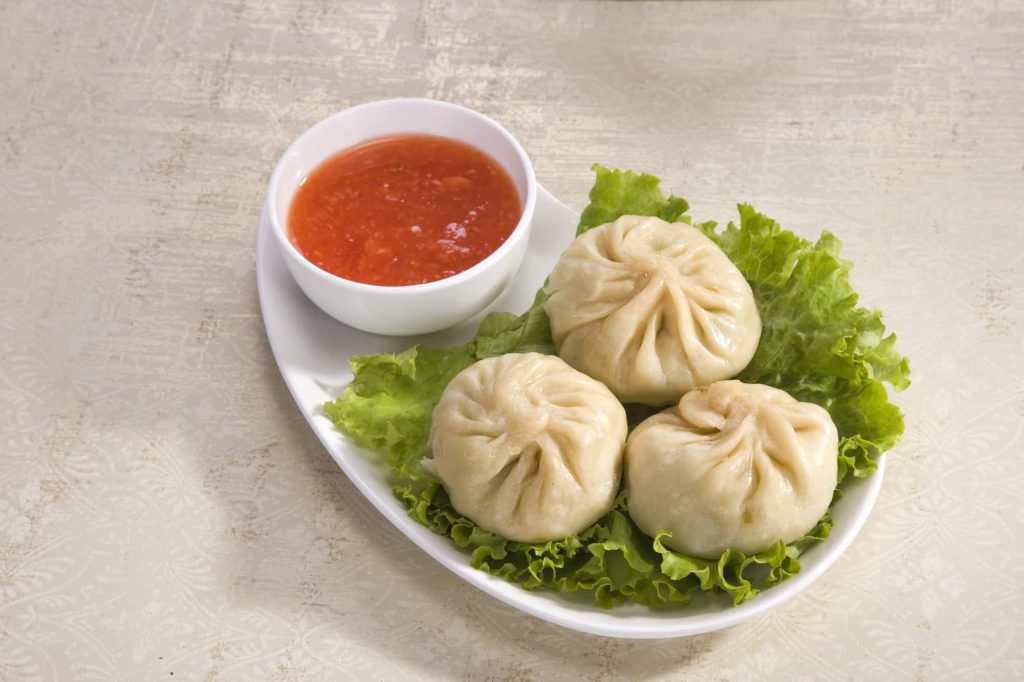 Traditional Dumpling Momos Served With Tomato Sauce