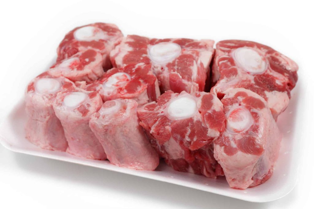 frozen oxtail on a tray