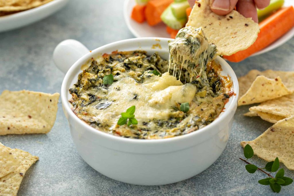 Artichoke spinach dip in a baking dish