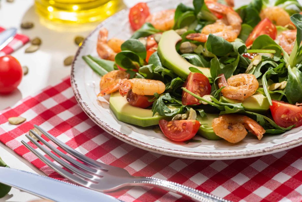 spinach salad on a plate on the table