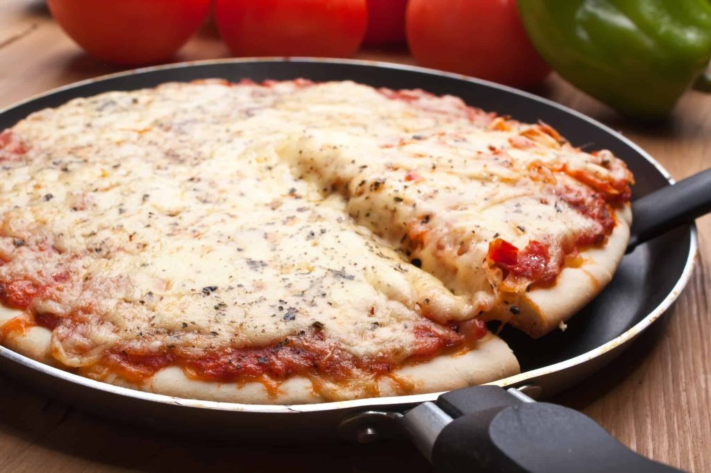 frozen pizza cooked in frying pan