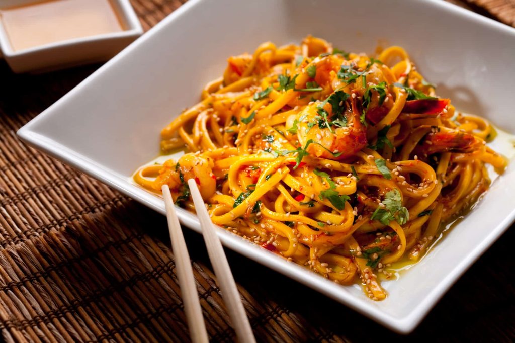 fried fideo pasta in a plate with chopsticks
