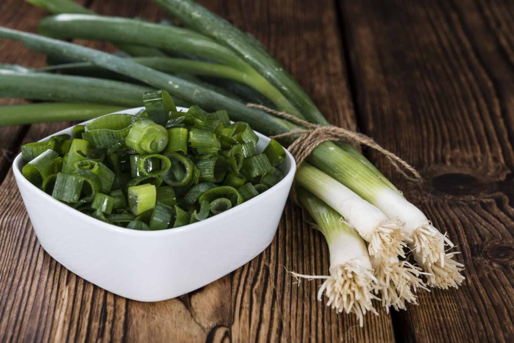 scallions on green onions on a table