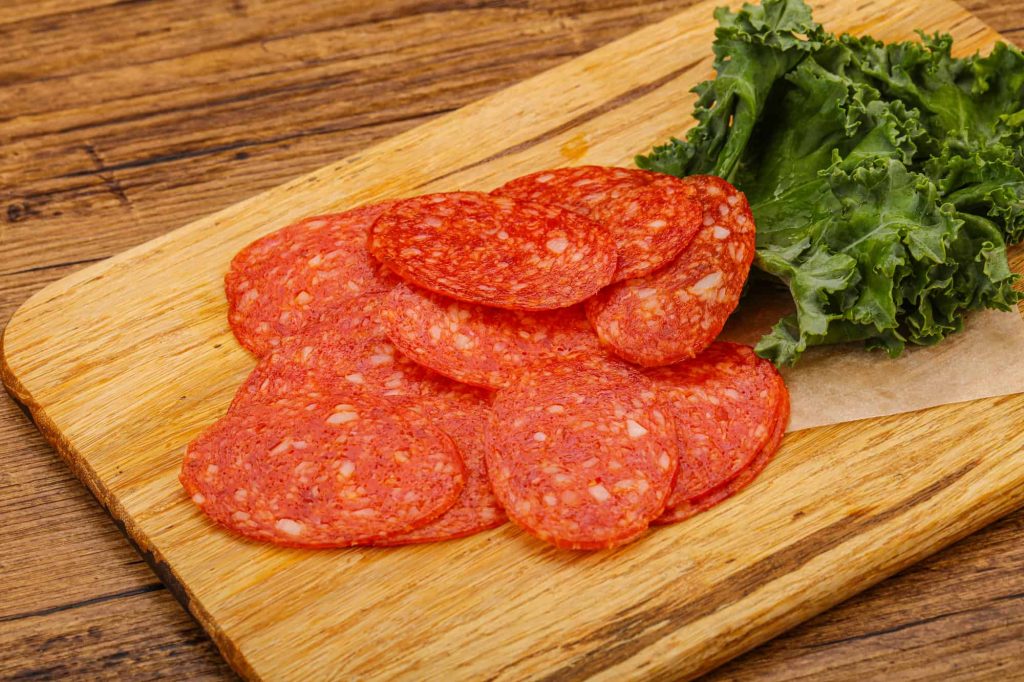 pepperoni slices on a board