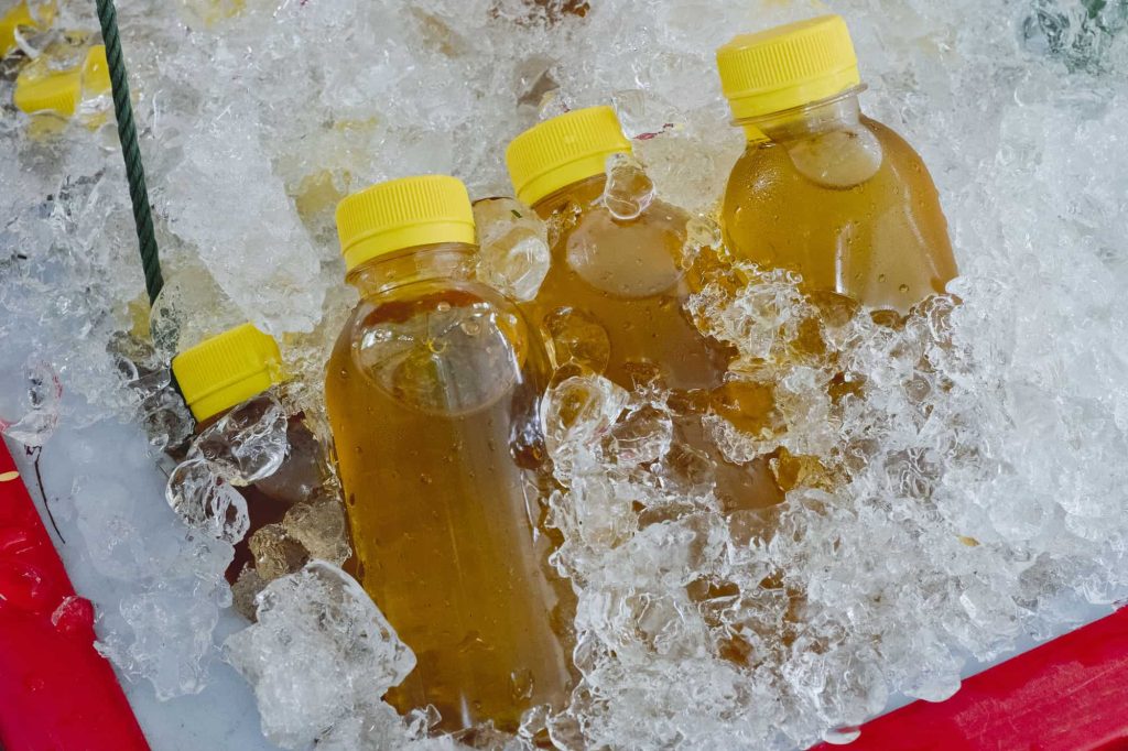 Juice in a plastic bottle on ice