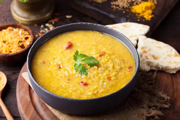 Dal tadka, yellow lentils finished with a tempering of cumin, garlic and ghee.