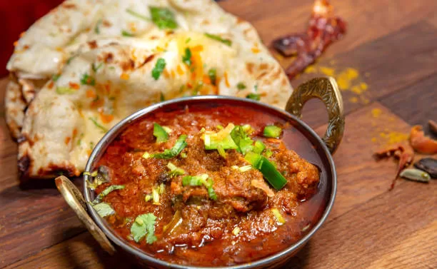Rogan josh, lamb slow-cooked in an aromatic Kashmiri curry sauce, served with rice.