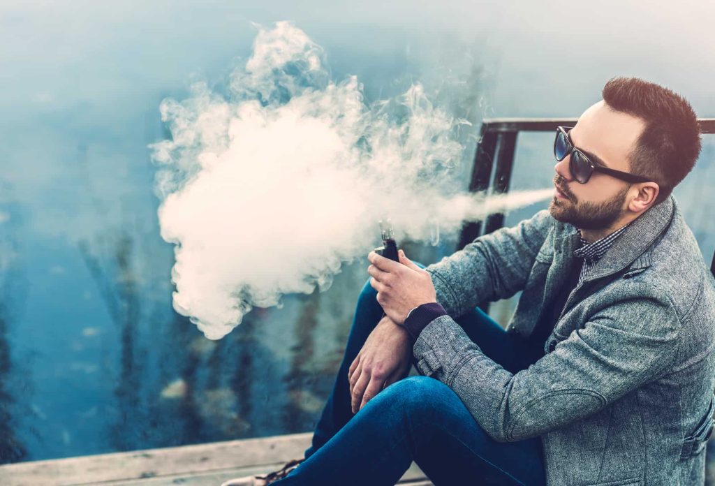 a man smoking chamomile outdoor