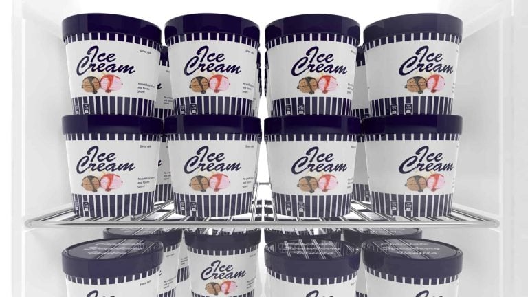 A display freezer filled with tubs of frozen ice cream. Each tub has a navy blue lid and a label with "Ice Cream" in bold letters, striped design, and images of three ice cream cones. The tubs are safely arranged on two shelves.