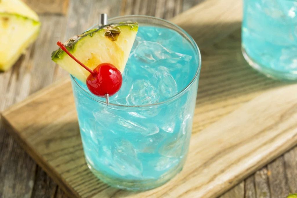 refreshing blue hawaiian punch with pineapple and cherry