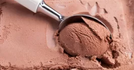 chocolate ice cream with spoon in the freezer