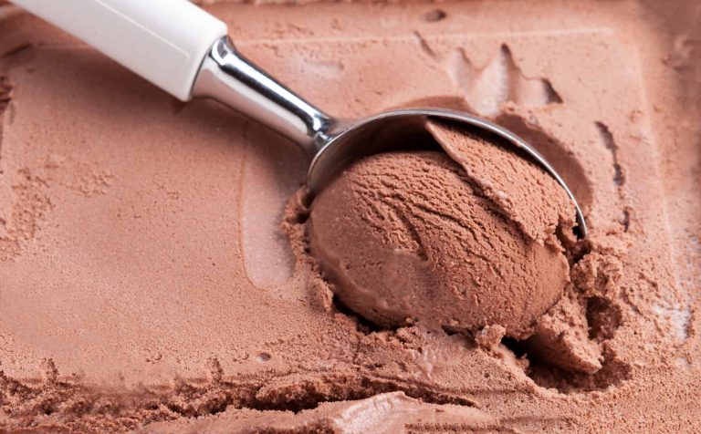 chocolate ice cream with spoon in the freezer