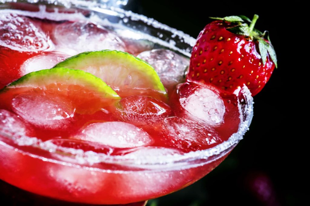 margarita with strawberry garnish