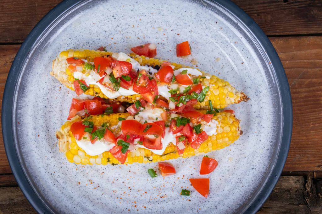 grilled corn with cream cheese and pico de gallo