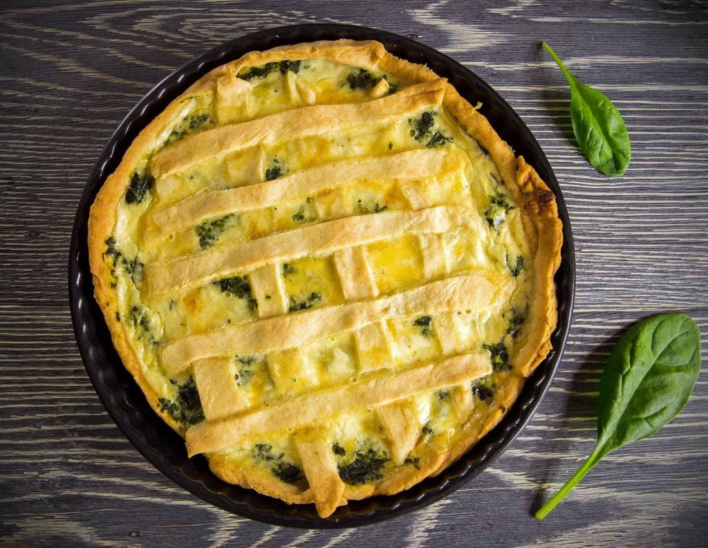 homemade spinach quiche baked in a pie pan