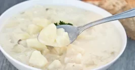 potato soup with spoon in a bowl