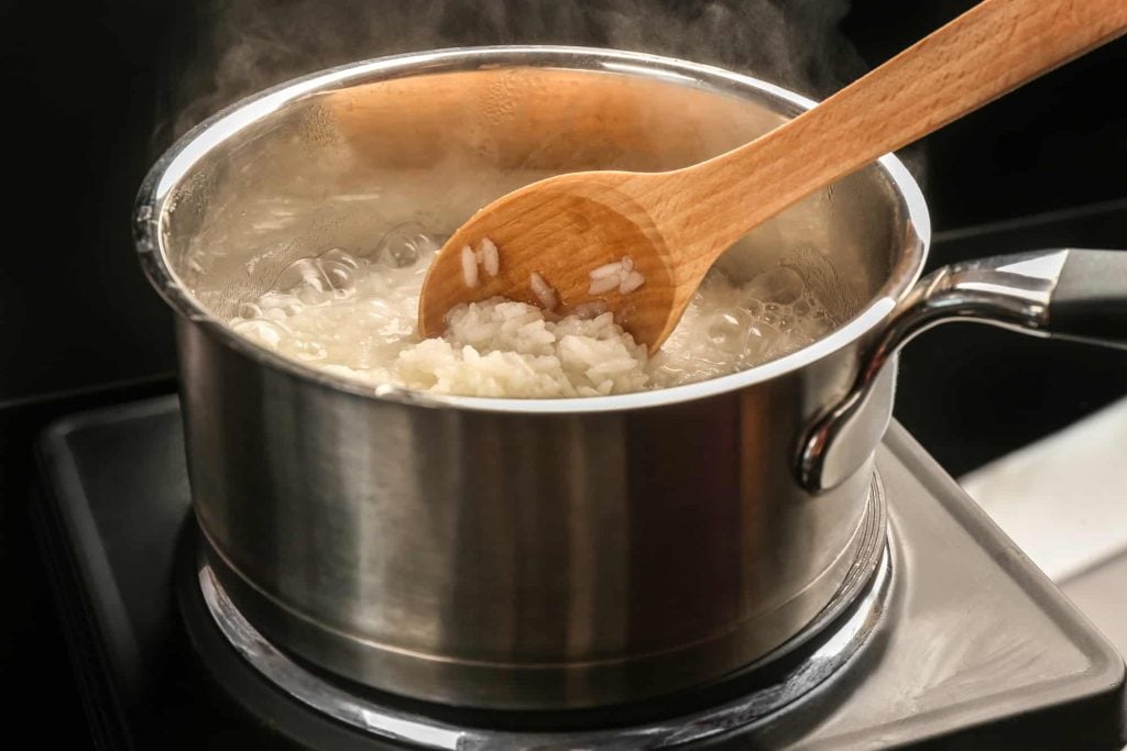 simmering rice in a pot