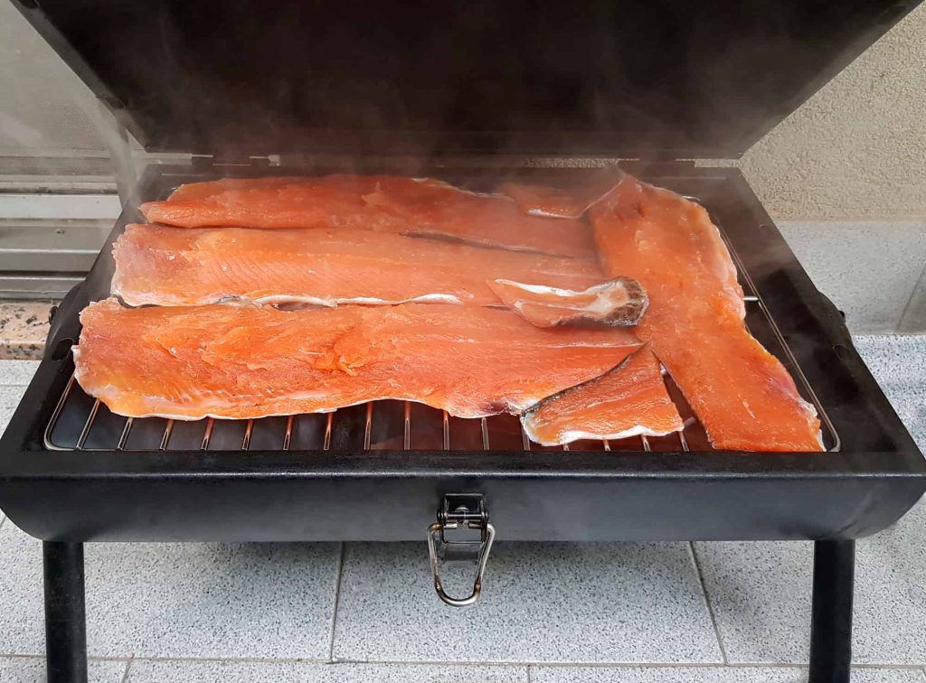 smoked trout fillets on barbecue grill