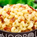 Delicious mac and cheese with bacon in a bowl