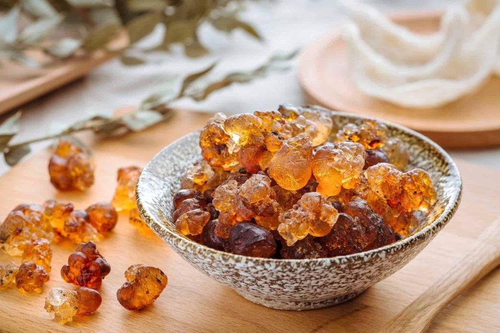 a bowl of peach gum on a table