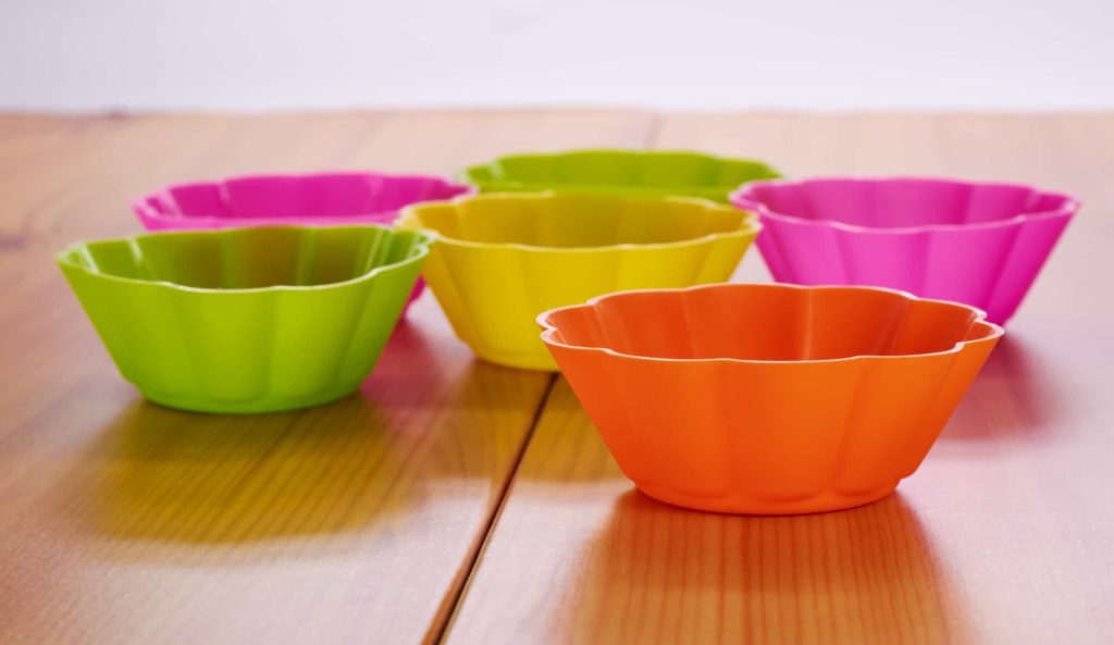 silicone cake pans on a wooden table