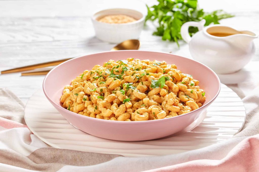 vegan mac and cheese in a pink bowl