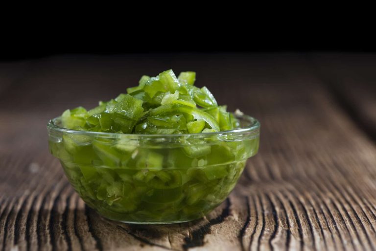 diced jalapenos in a bowl on a table