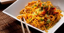 fried fideo pasta in a plate with chopsticks