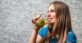 woman drinking jalapeno juice