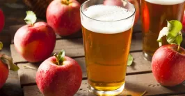 glasses of Hard Apple Cider on a wooden table