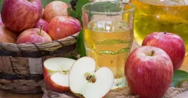 Glass of Apple Juice and Fresh Red Apples