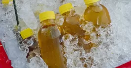 Juice in a plastic bottle on ice