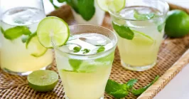 Lime juice with mint in jug and glasses