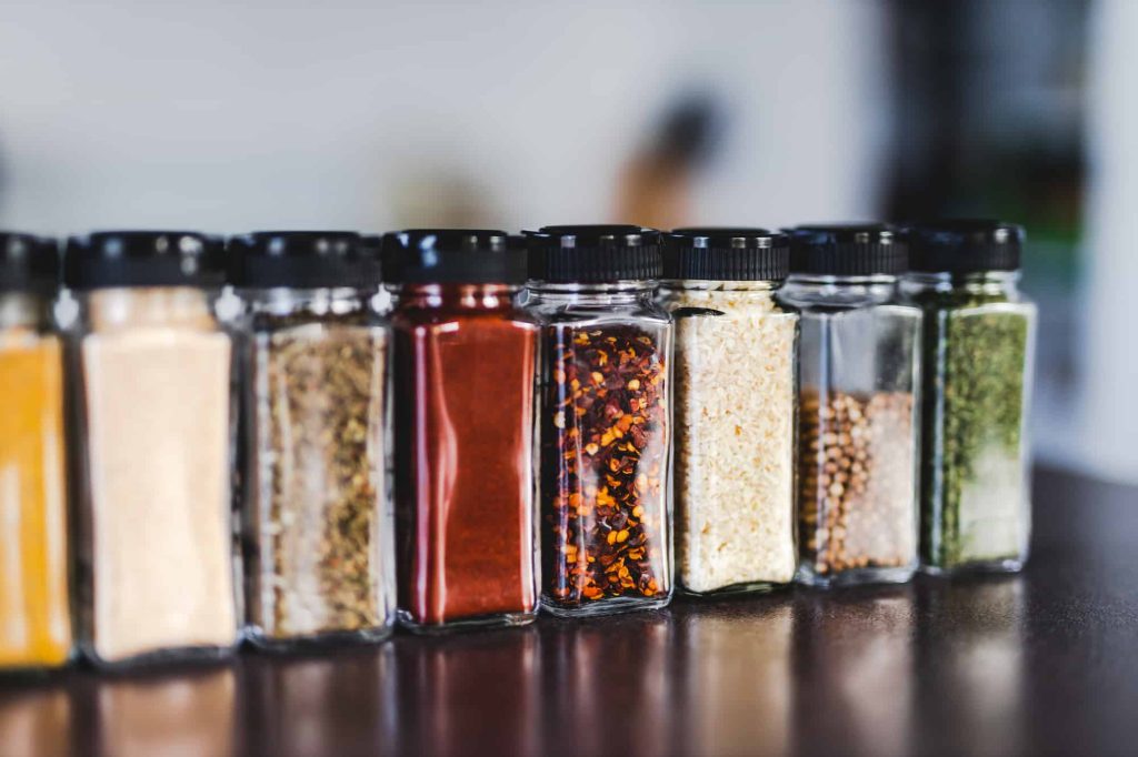 paprika powder and other spices in Jars