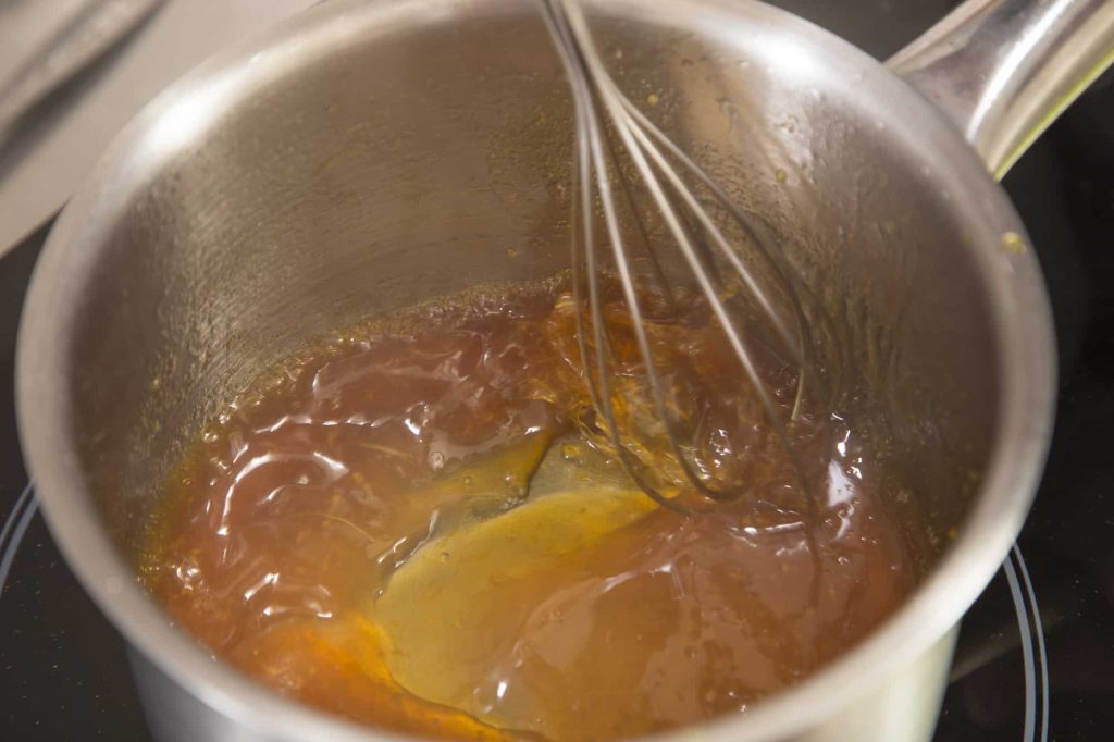 jelly ace recipe - combining gelatin powder, orange and sugar in a saucepan