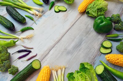 A colorful assortment of fruits and vegetables beautifully arranged in bowls, showcasing nature's bounty.