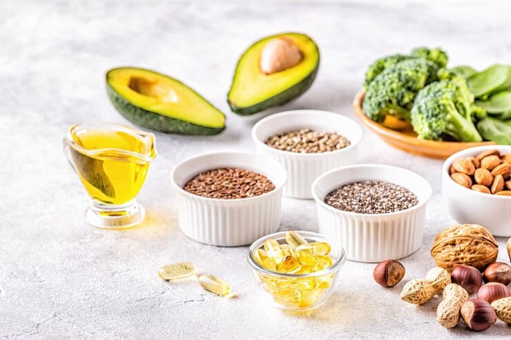 A colorful assortment of foods including nuts, avocado, and broccoli, highlighting a vegan diet for managing eczema.