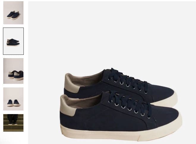 A pair of classic dark navy sneakers with a white sole, designed by Elliott, showcasing a stylish and versatile look.