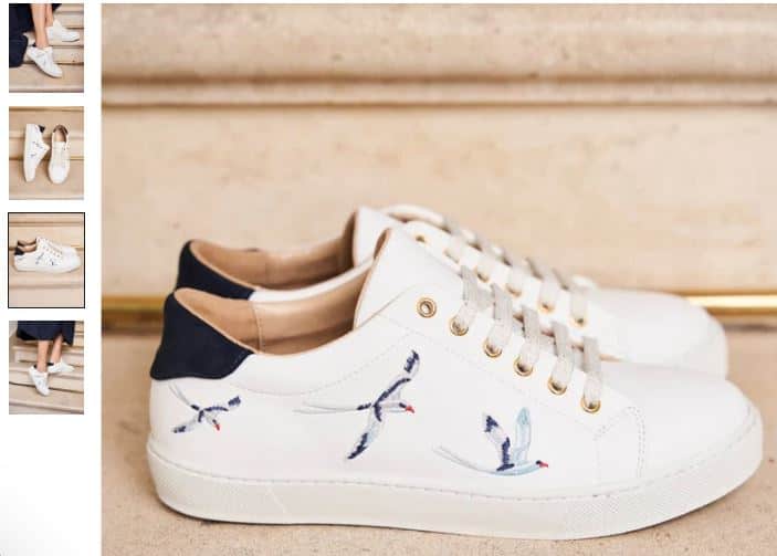  A pair of white sneakers featuring bird designs, labeled Virevolte Recycled Grain Vegan Sneakers by Minuit sur Terre.