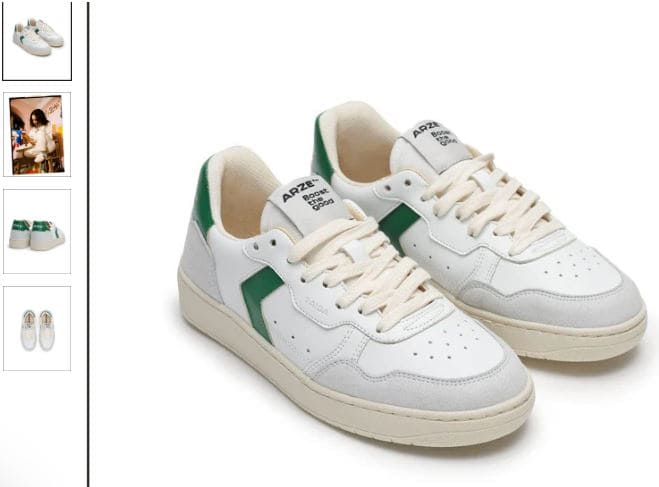 A pair of white sneakers featuring green trim, made from vegan corn leather by ARZE™.