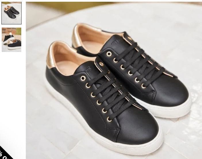 A pair of black leather sneakers featuring gold trim, designed as vegan trainers by Minuit sur Terre. 