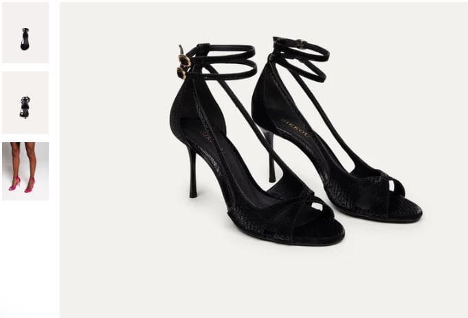 A pair of black strappy high heels by BIKKOU, perfect for a night out with friends at 9 PM.