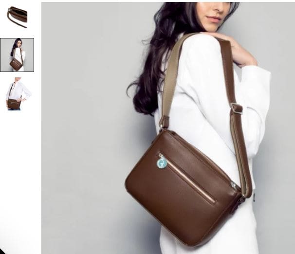 A woman holds a versatile brown and beige vegan leather crossbody handbag from The Morphbag by GSK.